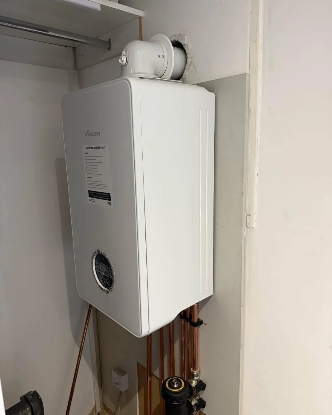Boiler with flue connection above