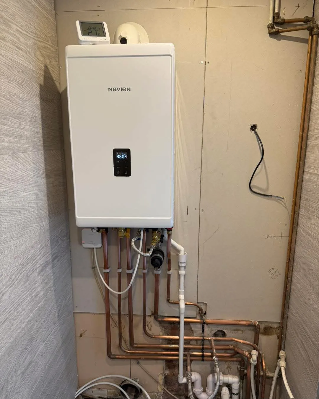 Boiler with exposed pipe connections