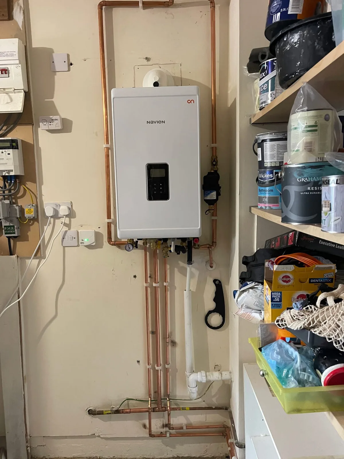 Wall-mounted boiler and adjacent pipework