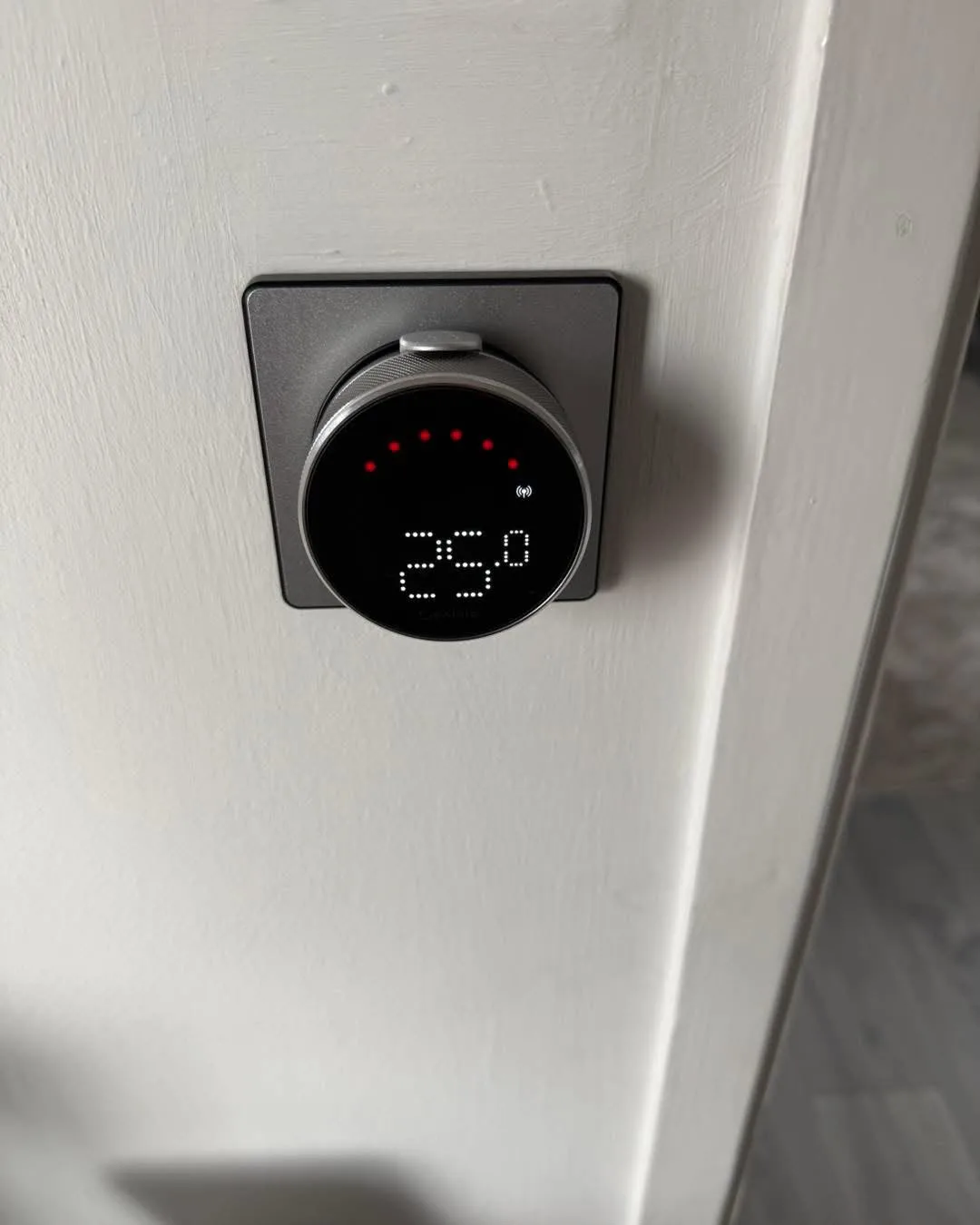 Wall-mounted smart thermostat